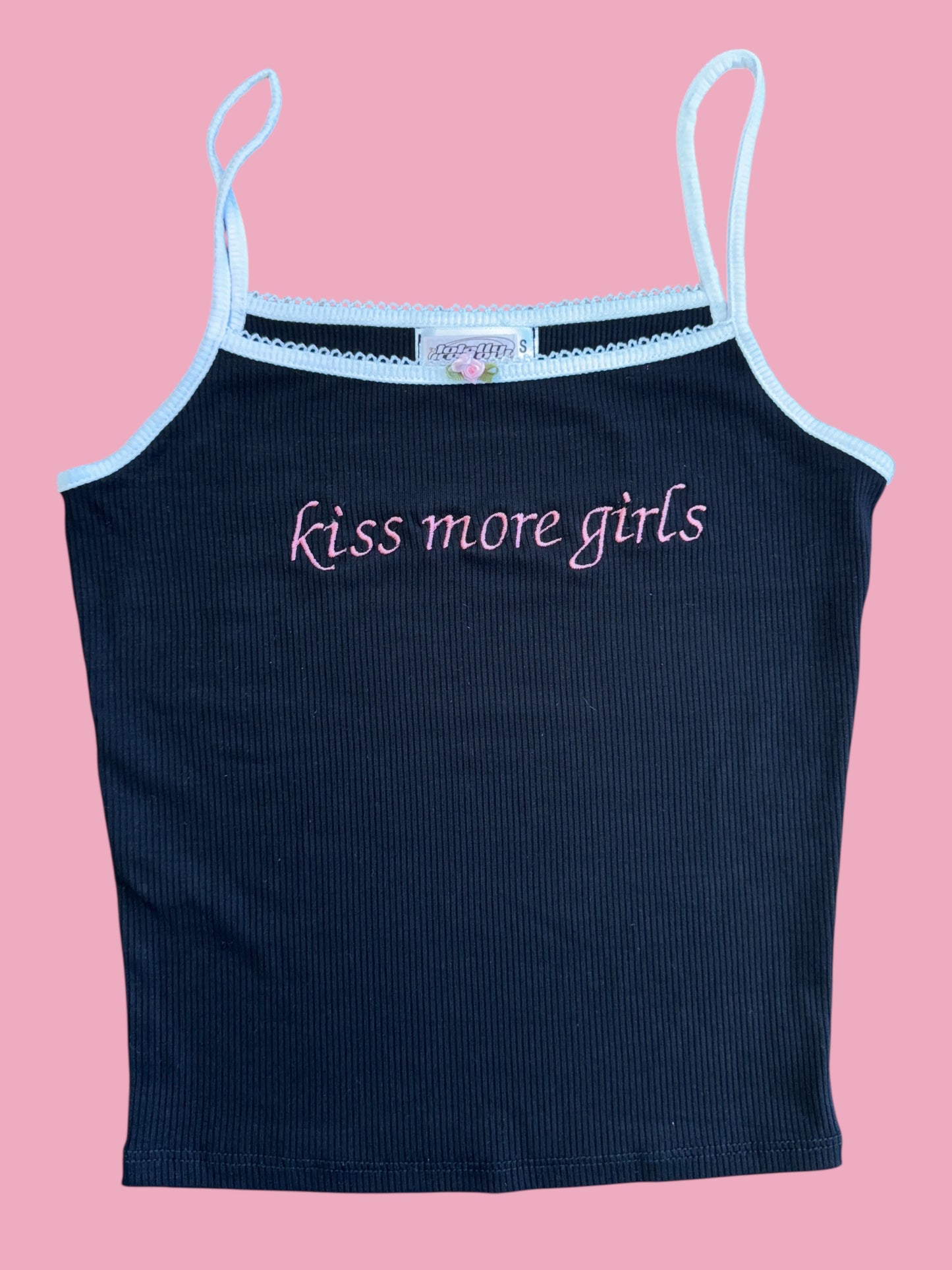 a women's tank top with the words kiss more girls on it