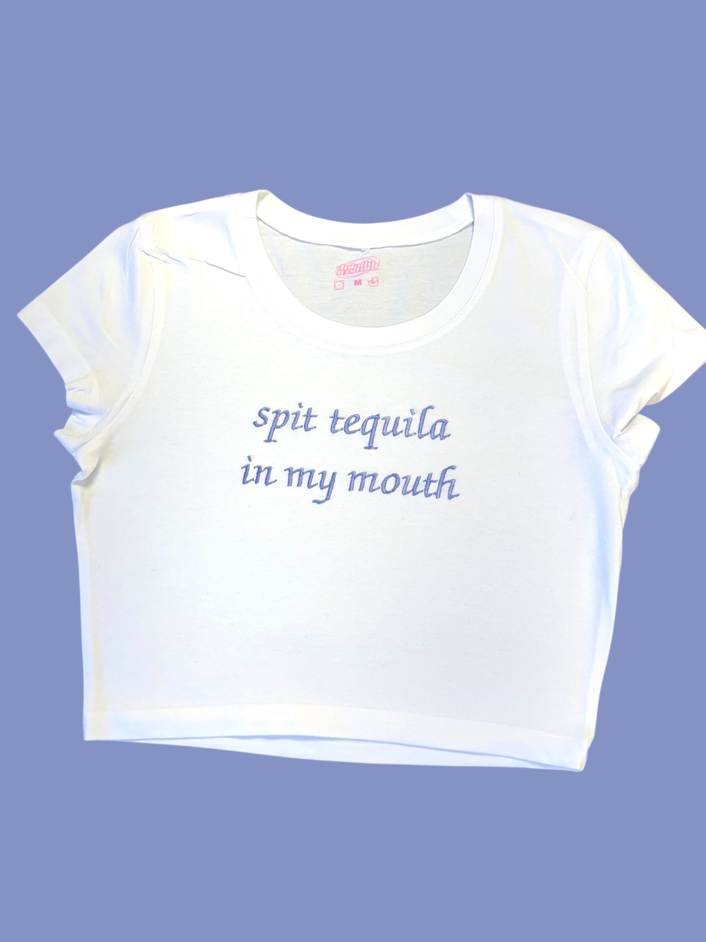 a white t - shirt that says, spit tequila in my mouth