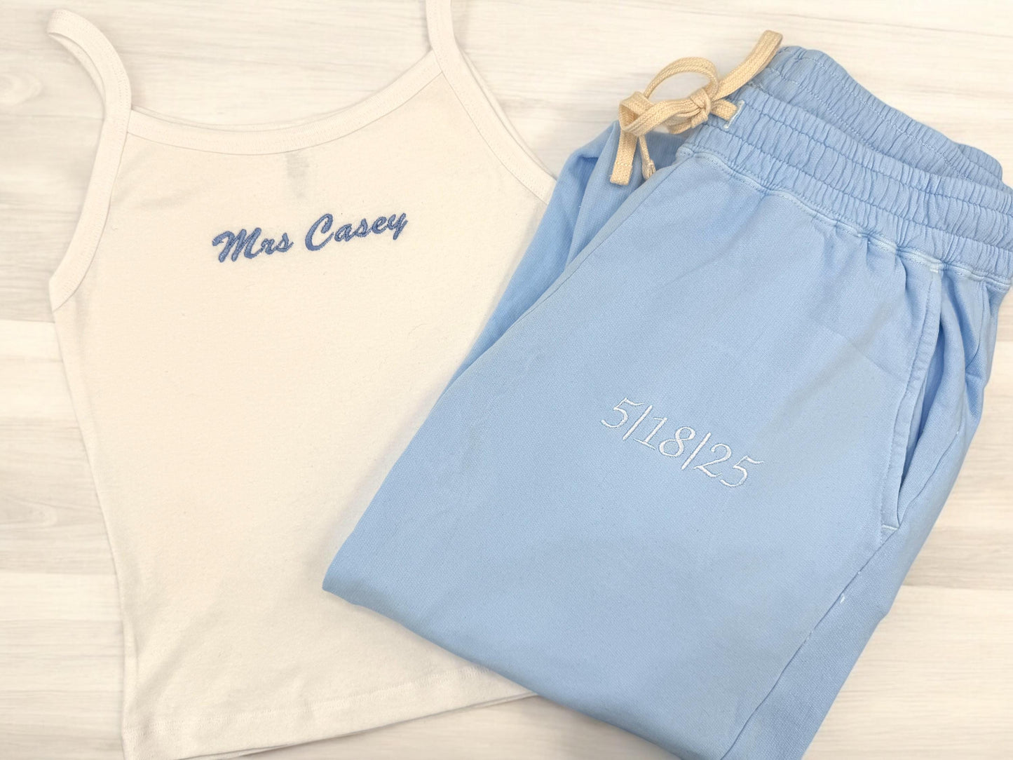 a pair of blue and white shorts and a tank top