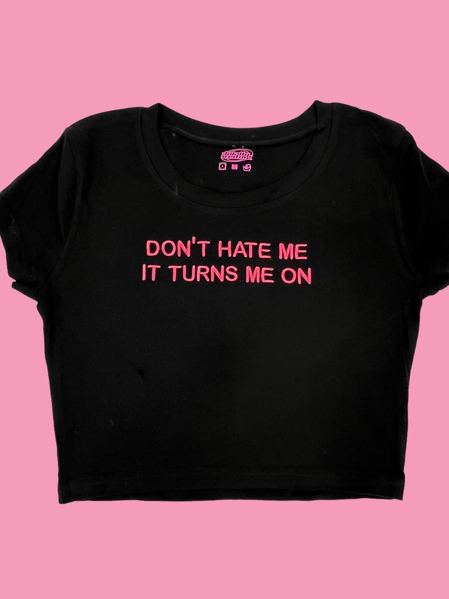 a t - shirt that says don't hate me it turns me on
