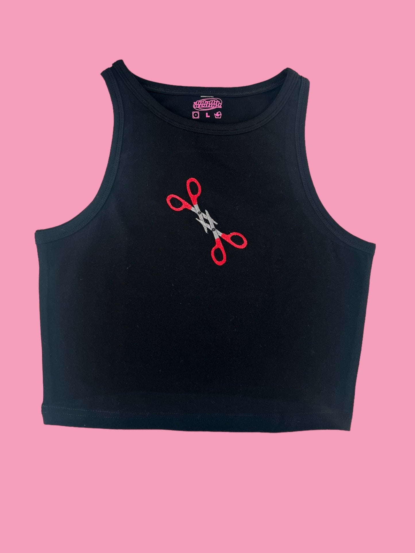 a black crop top with a pair of scissors on it