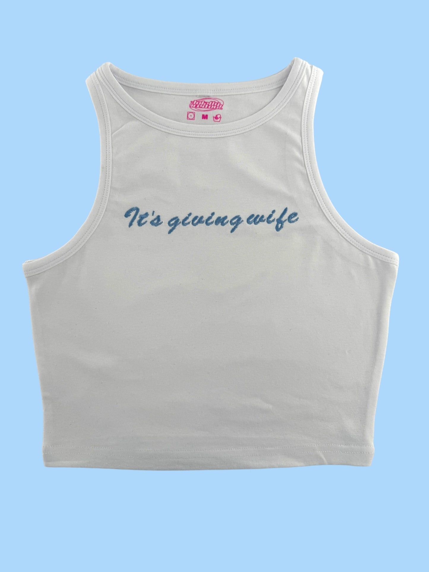 a white crop top that says it's going wife