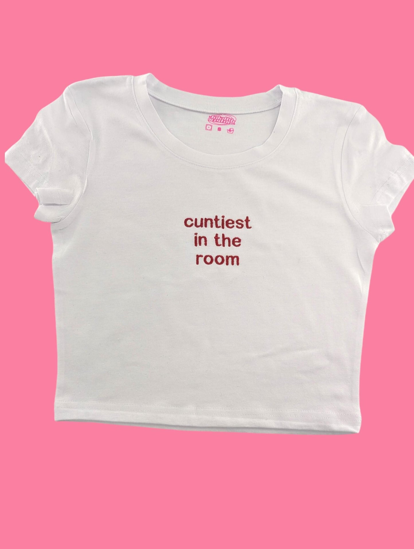 a white t - shirt with the words'cuntfest in the room '