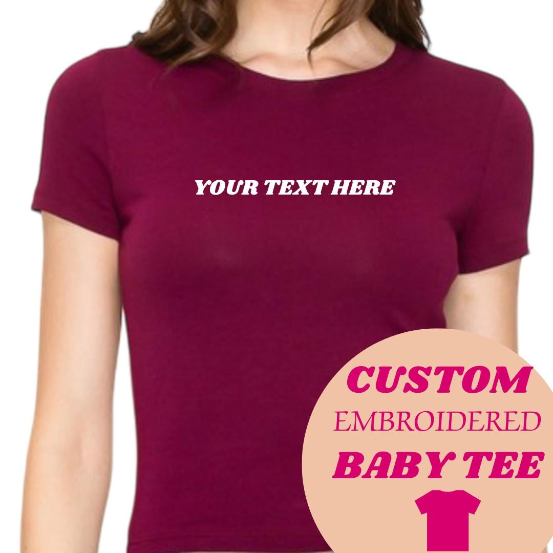 a women's t - shirt with the text custom embroidered on it