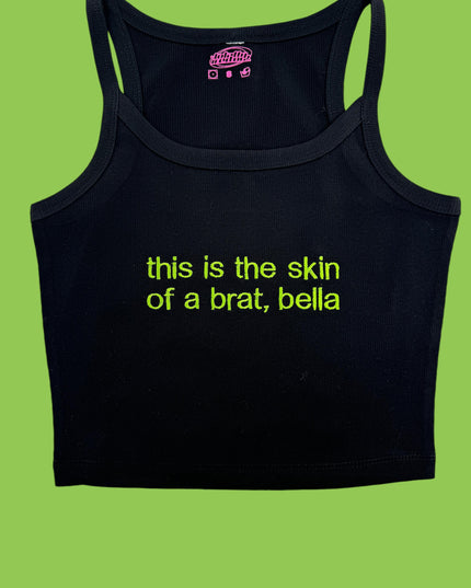 a black tank top that says, this is the skin of a brat, bel