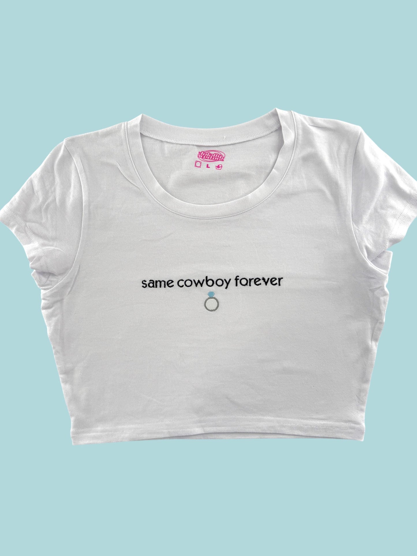 a white crop top that says same cowboy forever