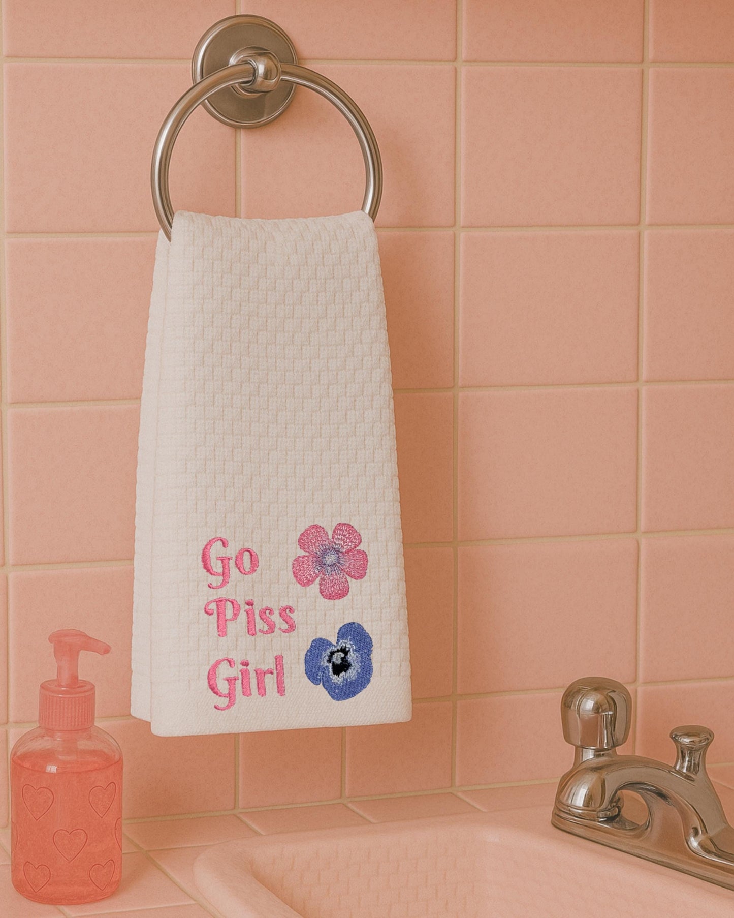 a towel hanging on a towel rack in a bathroom