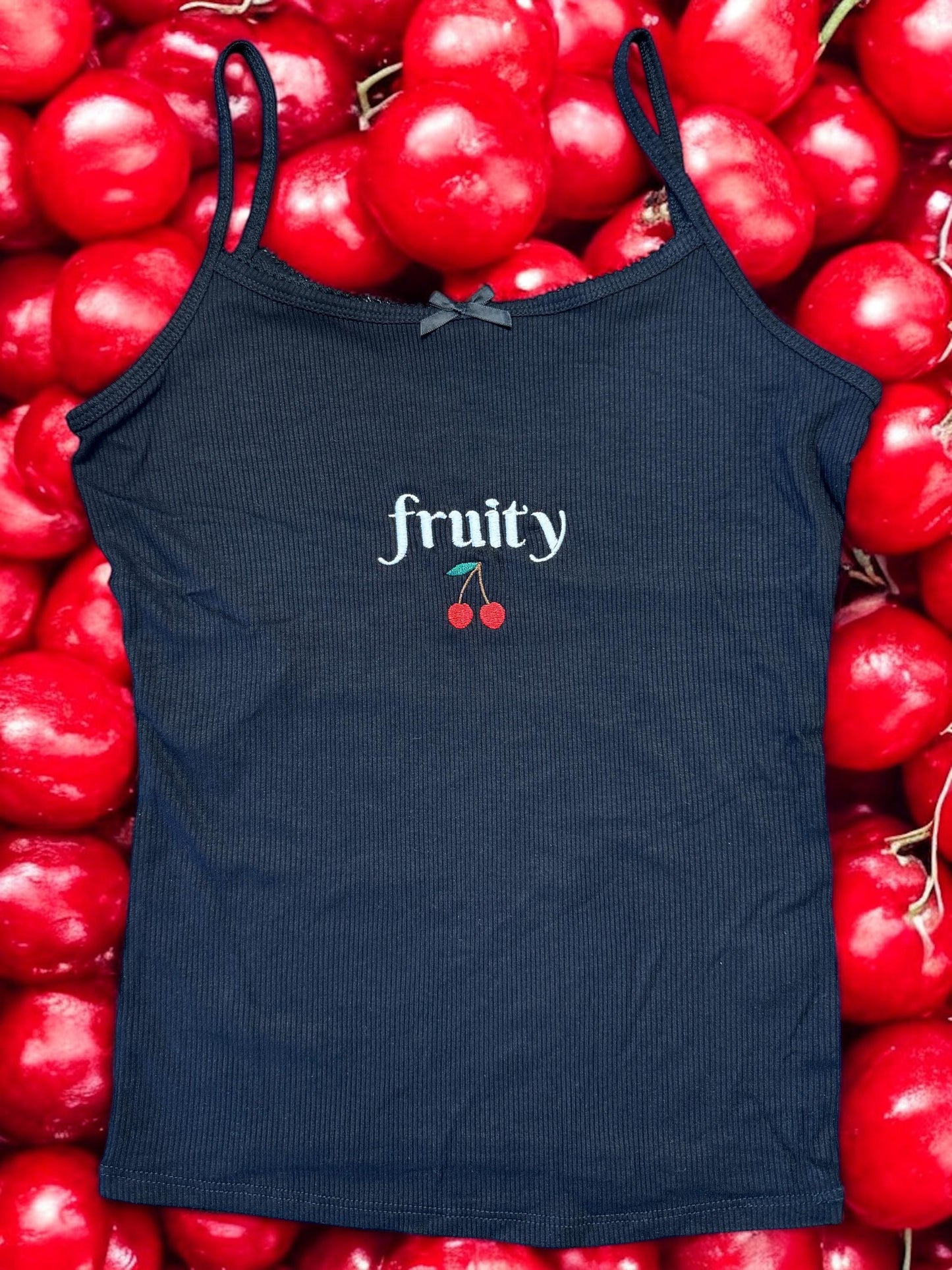 a black tank top with fruity written on it