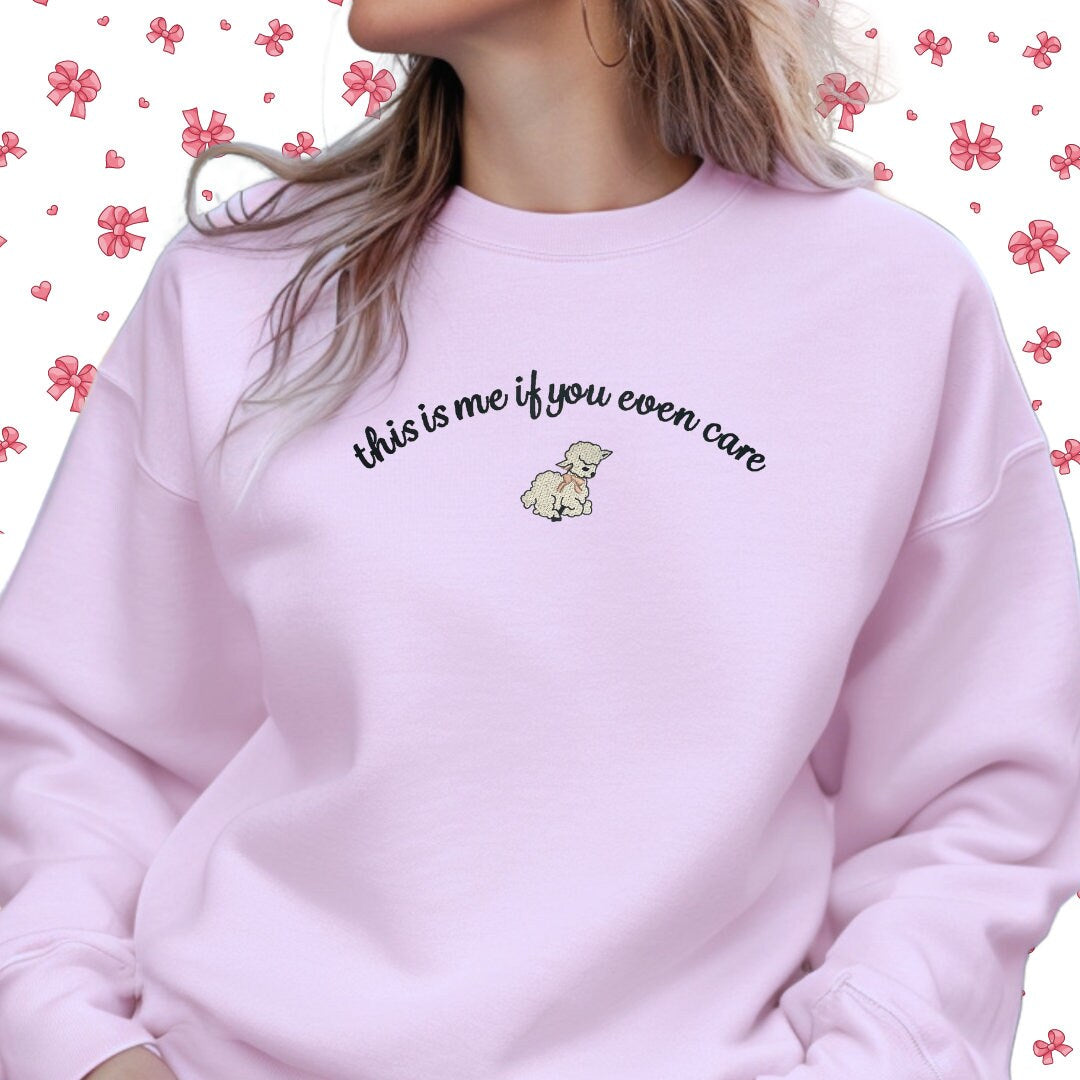 a woman wearing a pink sweatshirt with the words,'this is me if you