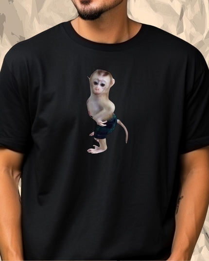 a man wearing a black shirt with a monkey on it