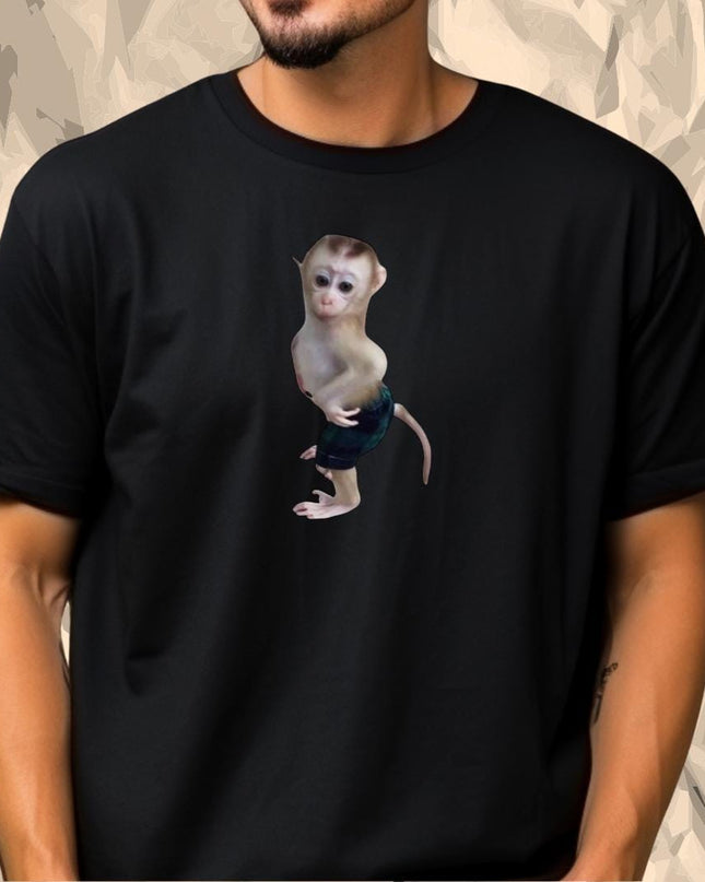 a man wearing a black shirt with a monkey on it
