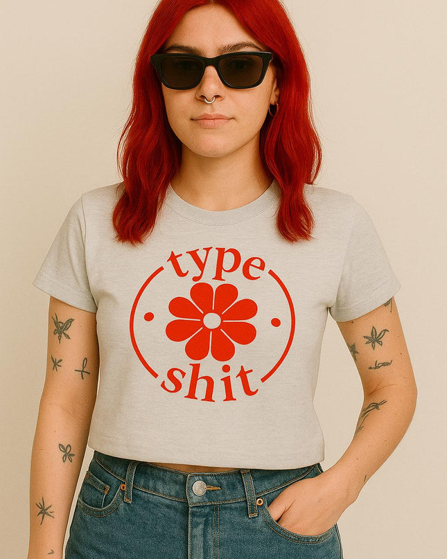 a woman with red hair wearing a type shit t - shirt