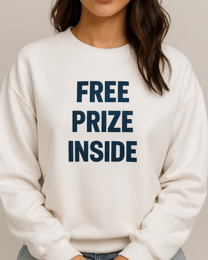 A woman wearing a white sweatshirt with the text "FREE PRIZE INSIDE" printed on it.