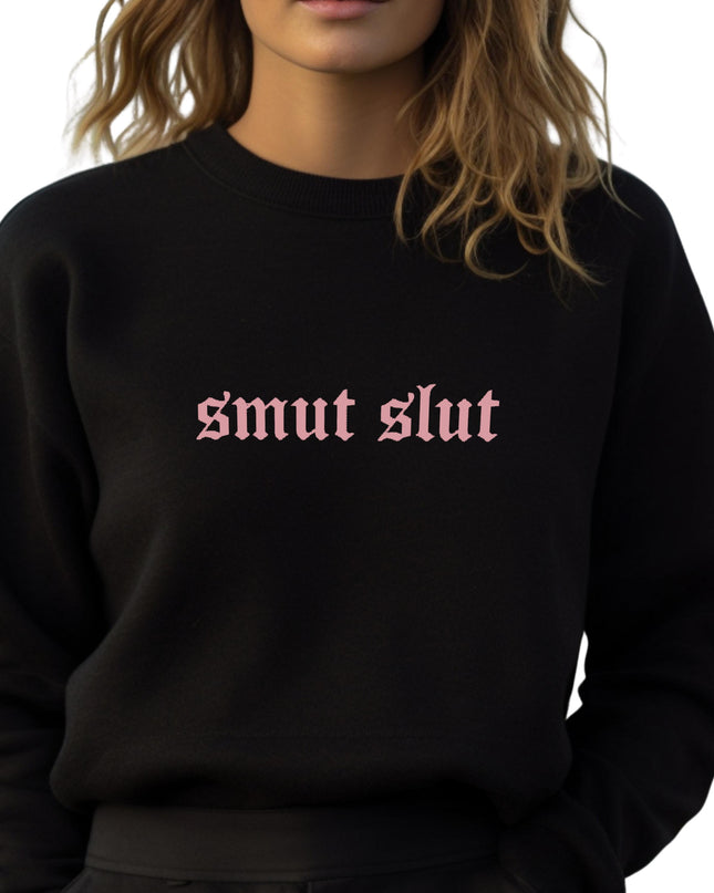 a woman wearing a black sweatshirt with the word smut slut printed on it