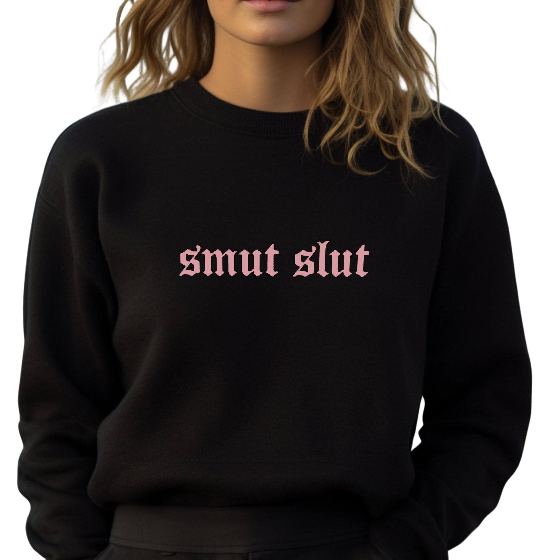a woman wearing a black sweatshirt with the word smut slut printed on it
