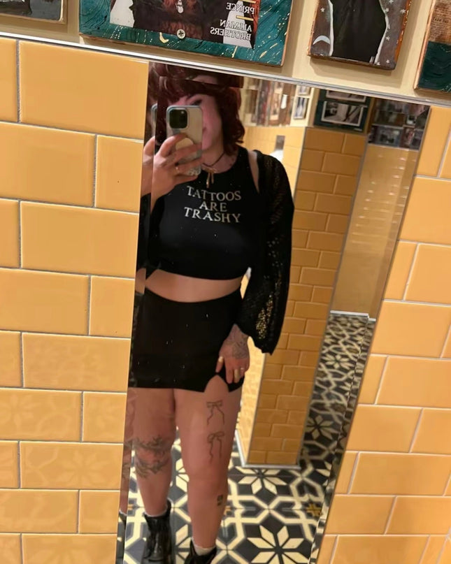 a woman taking a selfie in a mirror