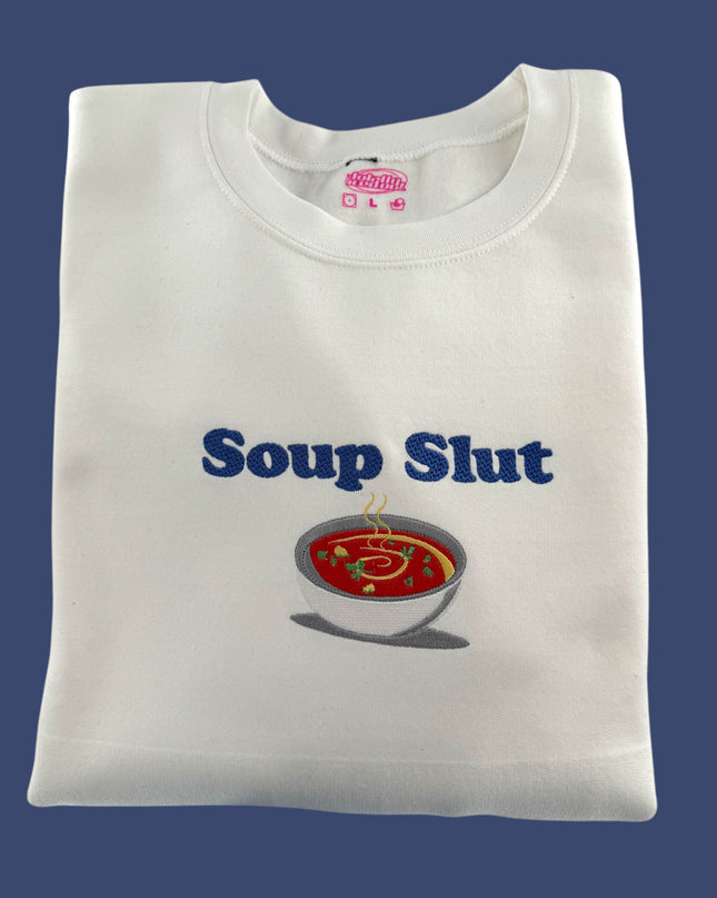 a white t - shirt with a soup logo on it
