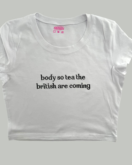 a white t - shirt that says body so tea the british are coming