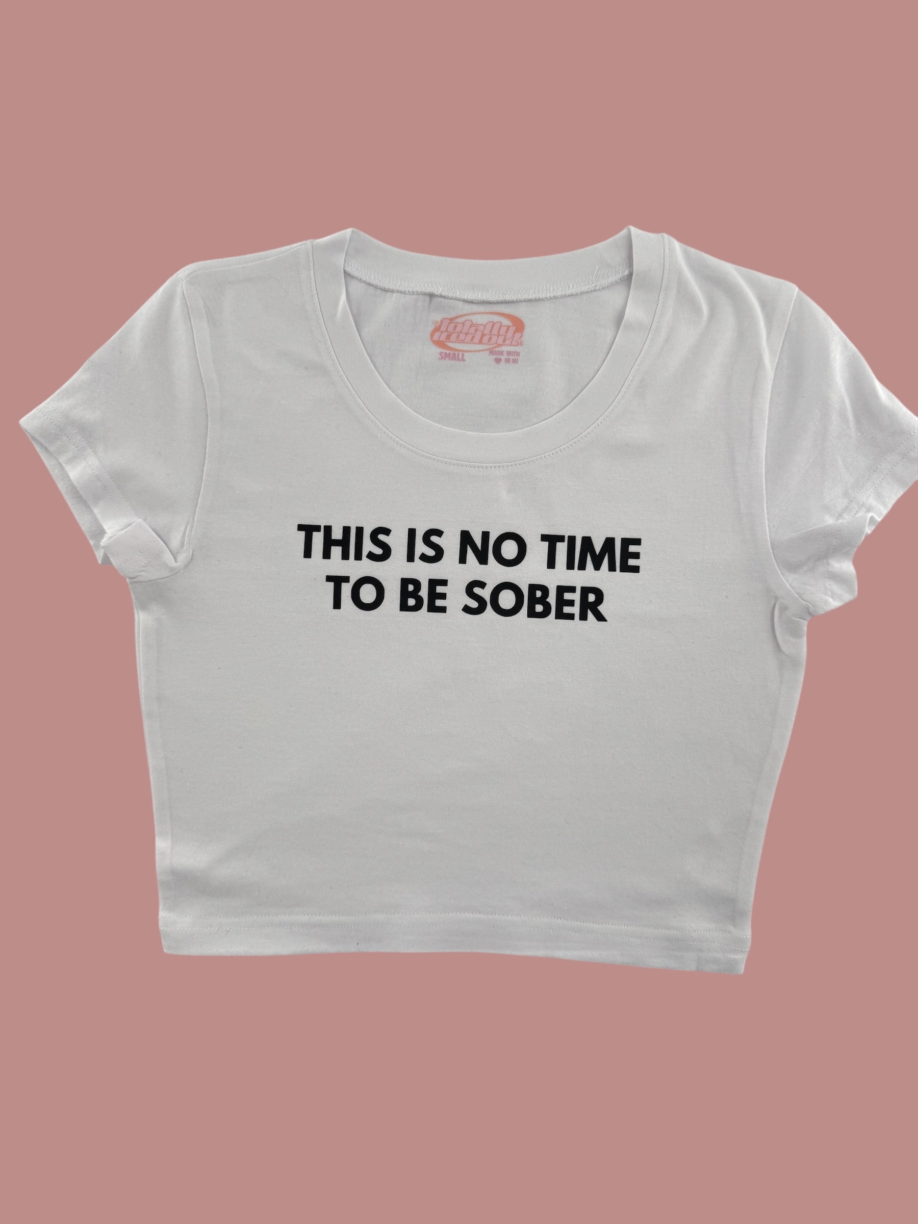 a white crop top that says, this is no time to be sober