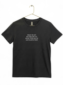 A black t-shirt with white text printed on it.