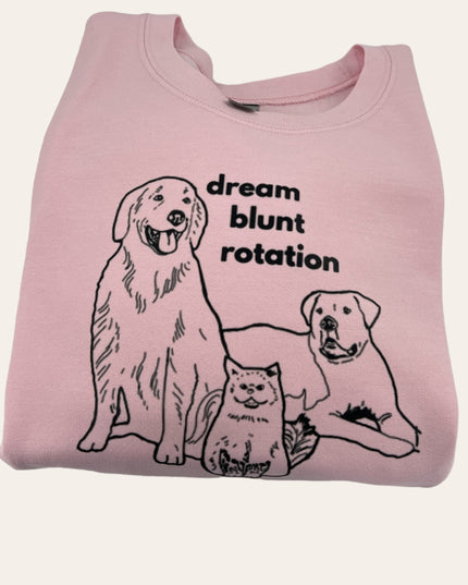 a pink shirt with two dogs and a cat on it