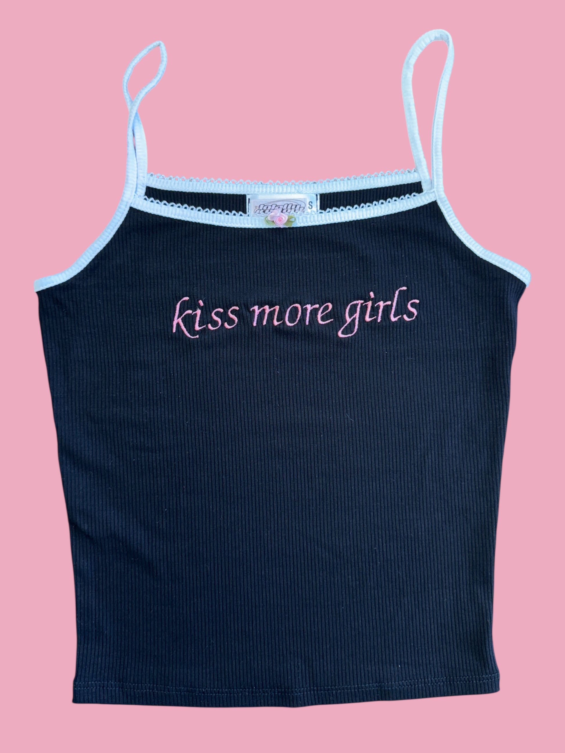 a women's tank top with the words kiss more girls on it
