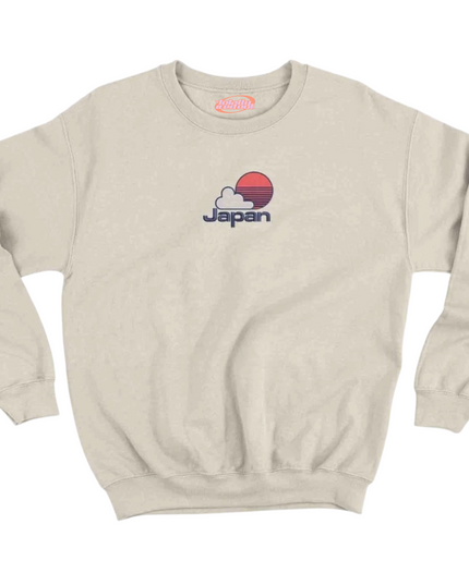 A beige sweatshirt with a graphic of a sunset and the word "Japan" printed on it.