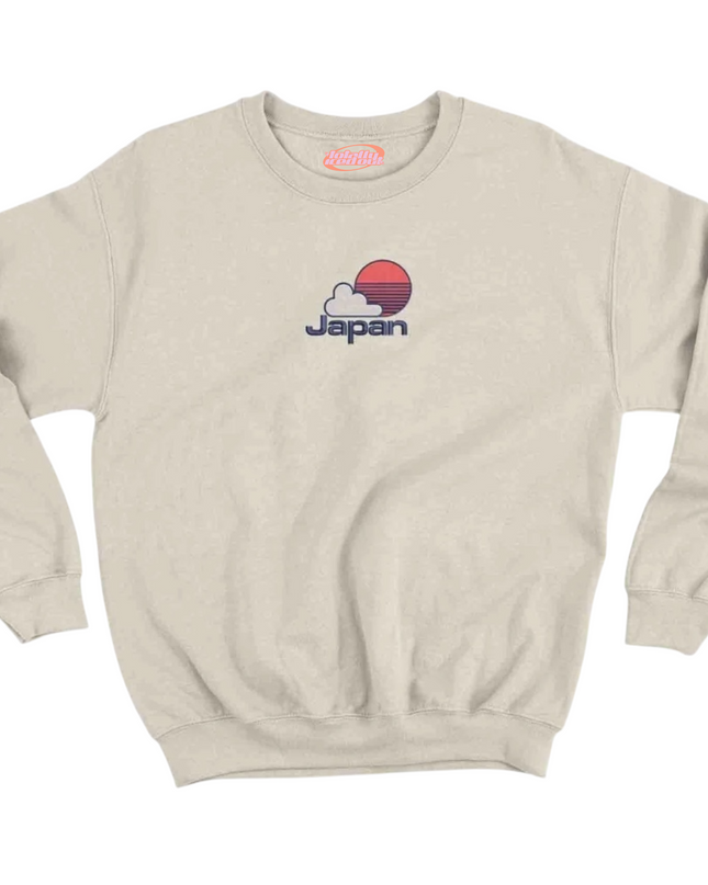 A beige sweatshirt with a graphic of a sunset and the word "Japan" printed on it.