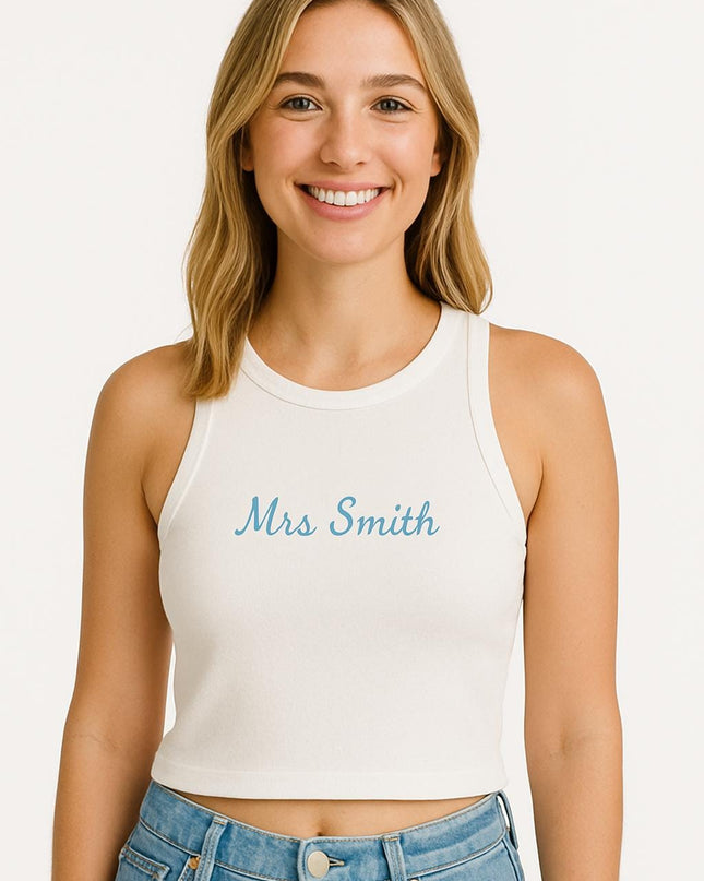 a woman wearing a white tank top with the word mrs smith on it