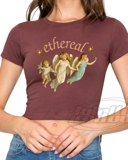 a woman wearing a t - shirt with angels on it