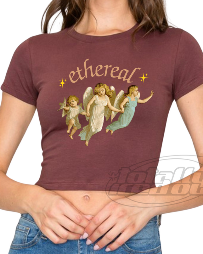 a woman wearing a t - shirt with angels on it