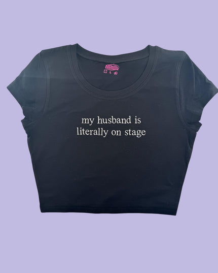 a t - shirt that says, my husband is literally on stage