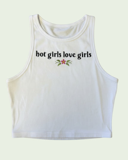 A white crop top with the text "hot girls love girls" printed on it.