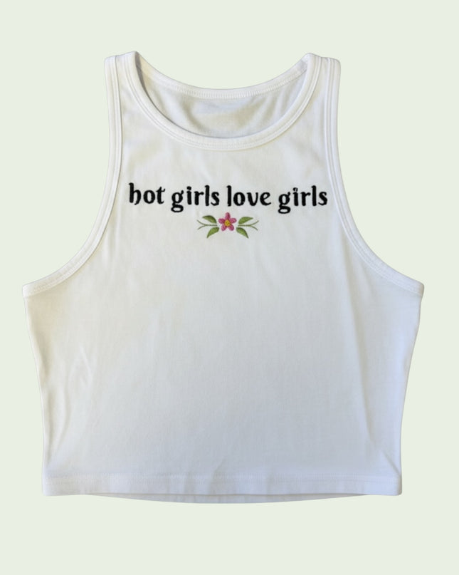 A white crop top with the text "hot girls love girls" printed on it.