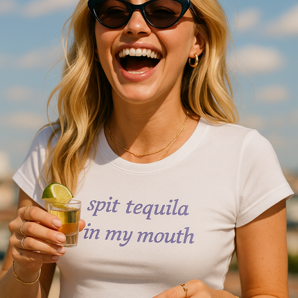 a woman in a white shirt holding a drink