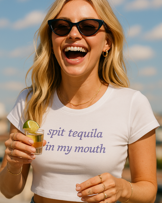 a woman in a white shirt holding a drink