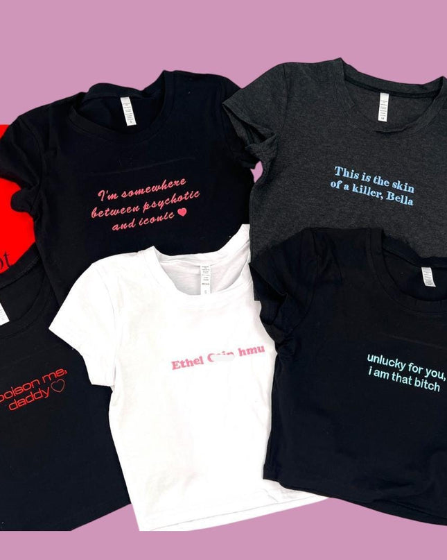 a group of t - shirts on a pink background