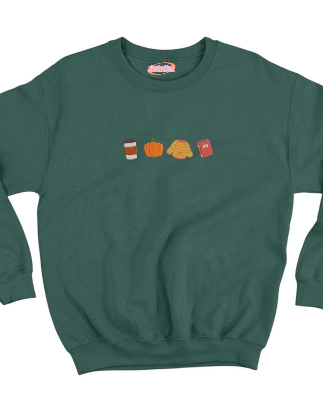 A green sweatshirt with a graphic design featuring four different objects: a coffee cup, a pumpkin, a scarf, and a phone.