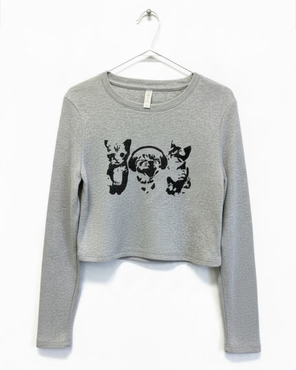 A gray long-sleeved shirt with a graphic design featuring three cats.