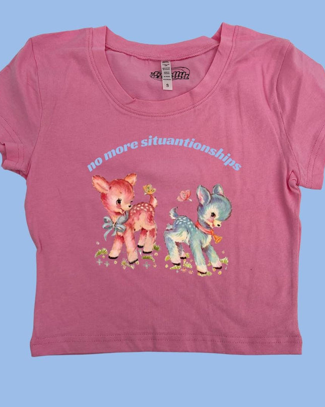 a pink t - shirt with a picture of two small animals on it
