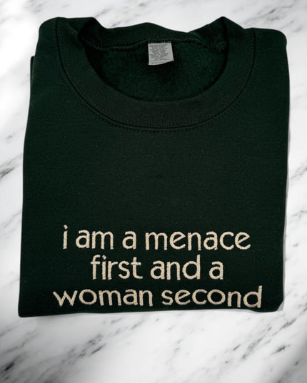 a t - shirt that says i am a menache first and a woman second