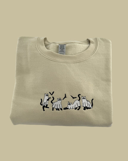 a t - shirt with a picture of a dog and three cats on it