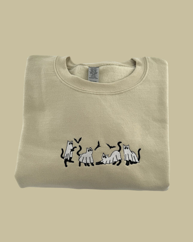 a t - shirt with a picture of a dog and three cats on it