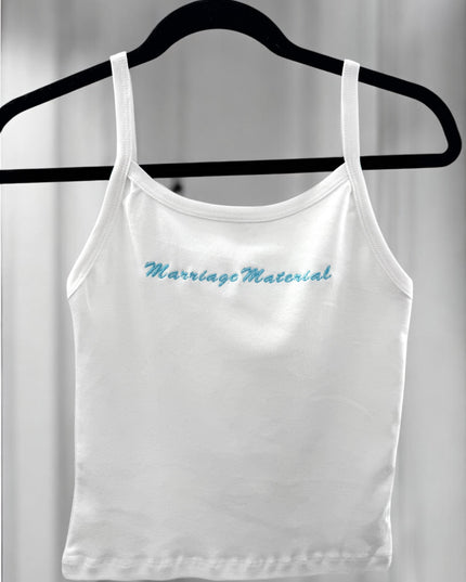 a white crop top with a blue message on it