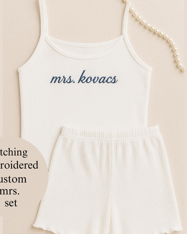 a white tank top and shorts with the words miss kounces on it