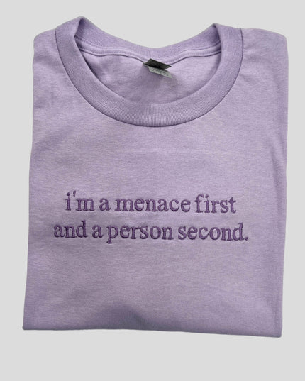 a purple t - shirt that says i'm a mence first and a