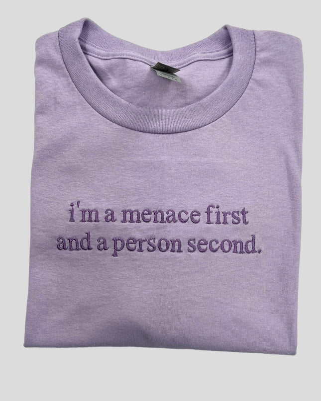 a purple t - shirt that says i'm a mence first and a