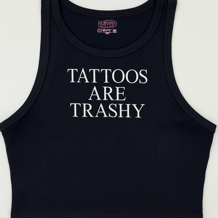 A black crop top with white text that reads "TATTOES ARE TRASHY".