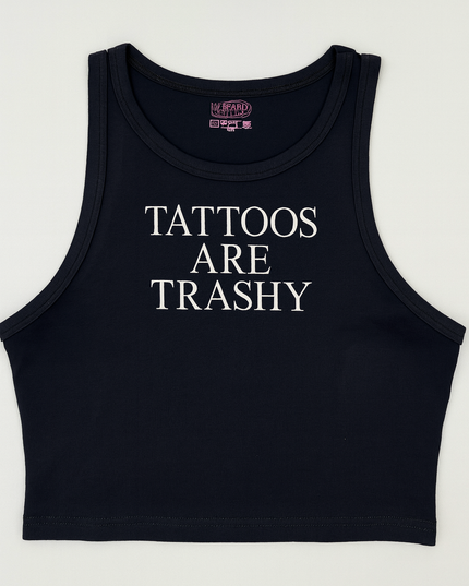 A black crop top with white text that reads "TATTOES ARE TRASHY".