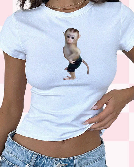 a woman wearing a white shirt with a monkey on it